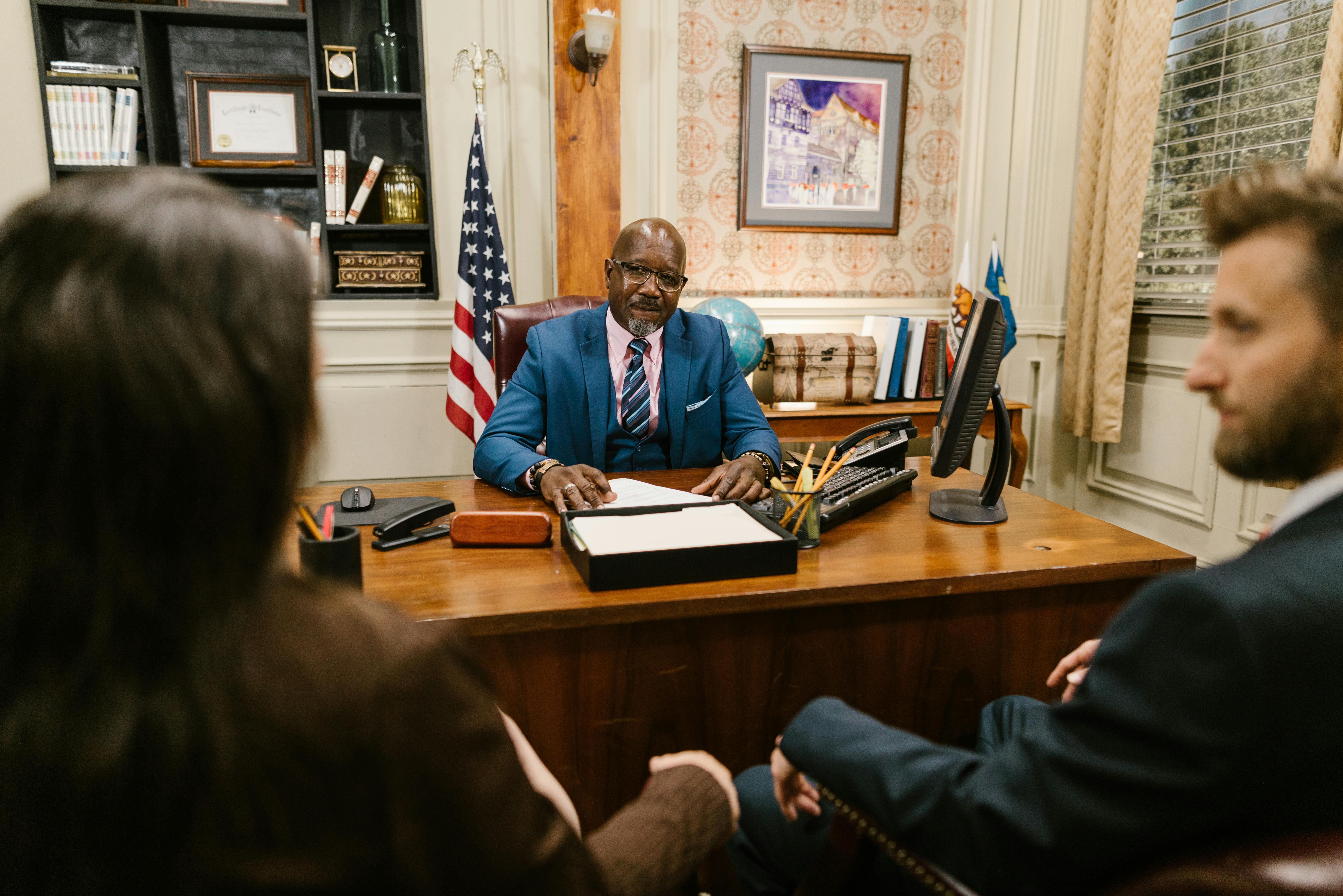 Legal professionals in a formal office meeting